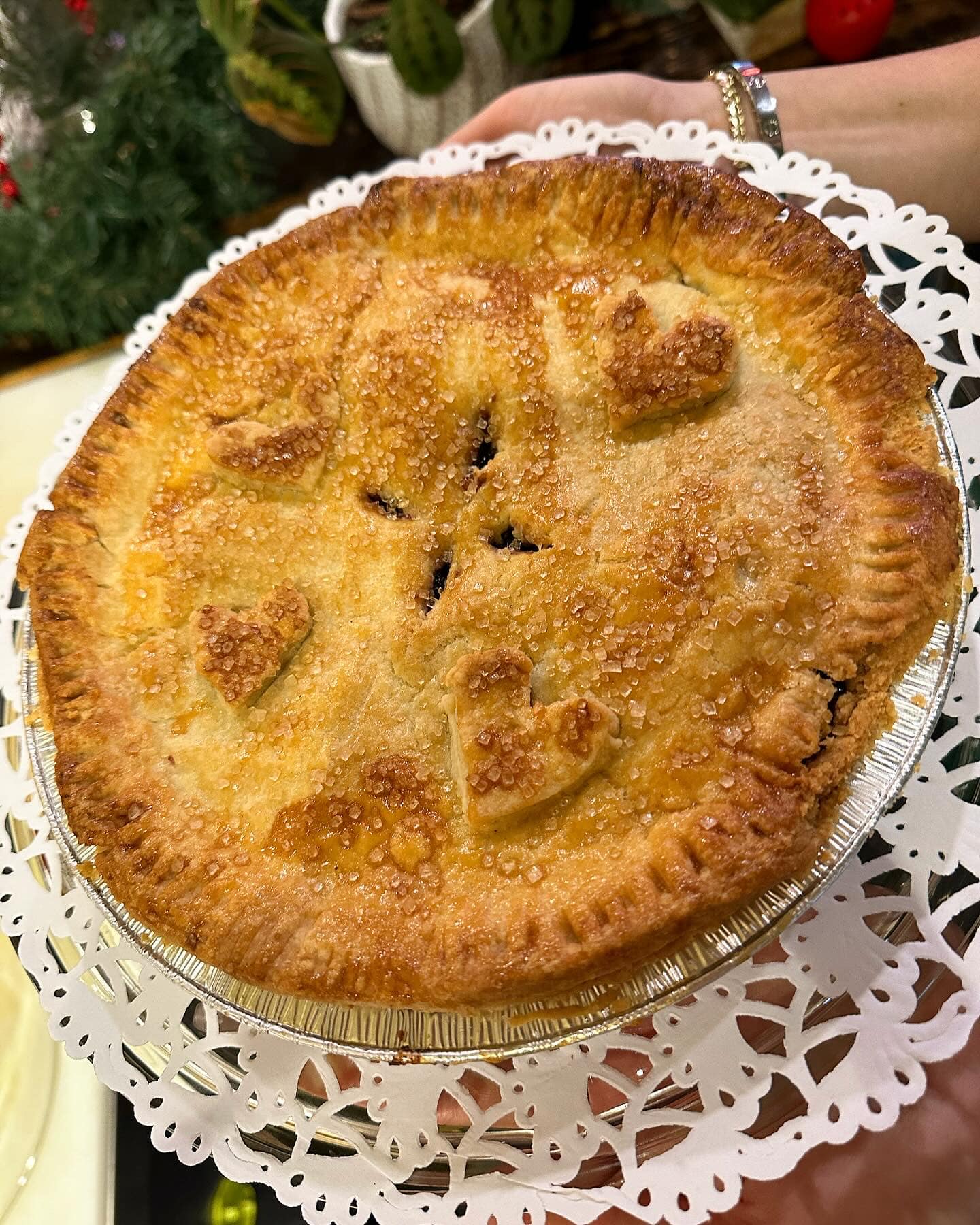 Golden pie with decorative apple crust