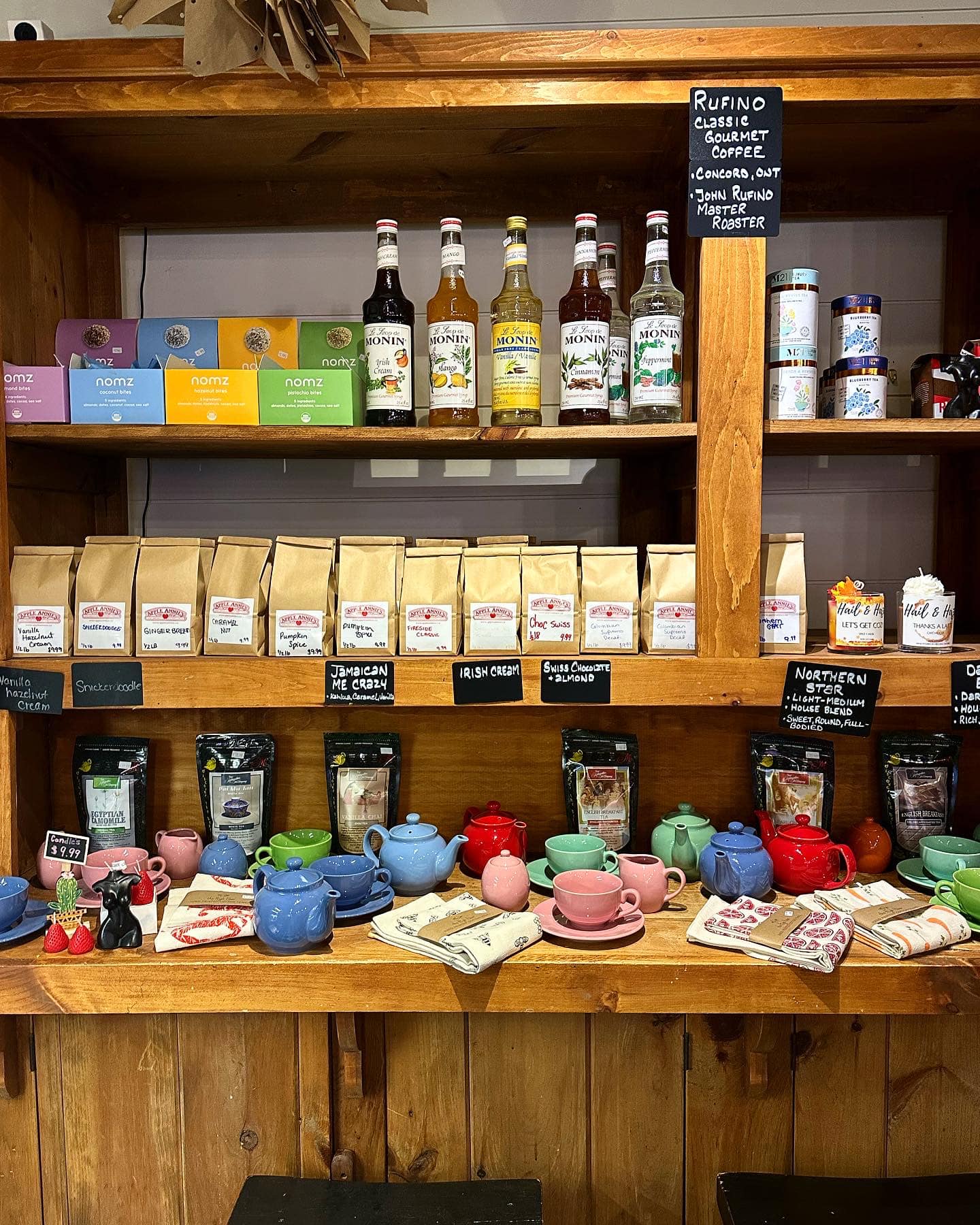 Coffee display with colorful teapots and gourmet blends